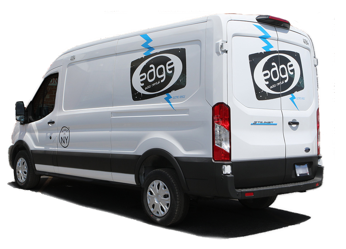 White Ford Transit van with "Edge" logo and blue lightning graphics on the rear and side.